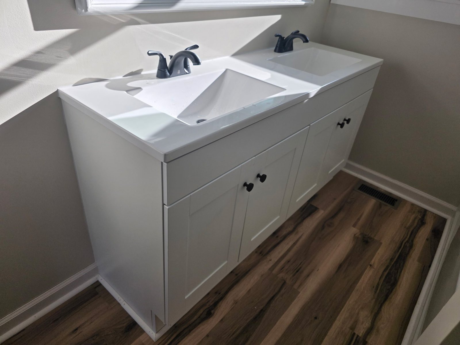 Finished double vanity with black faucets in a Yadkinville, NC bathroom remodel